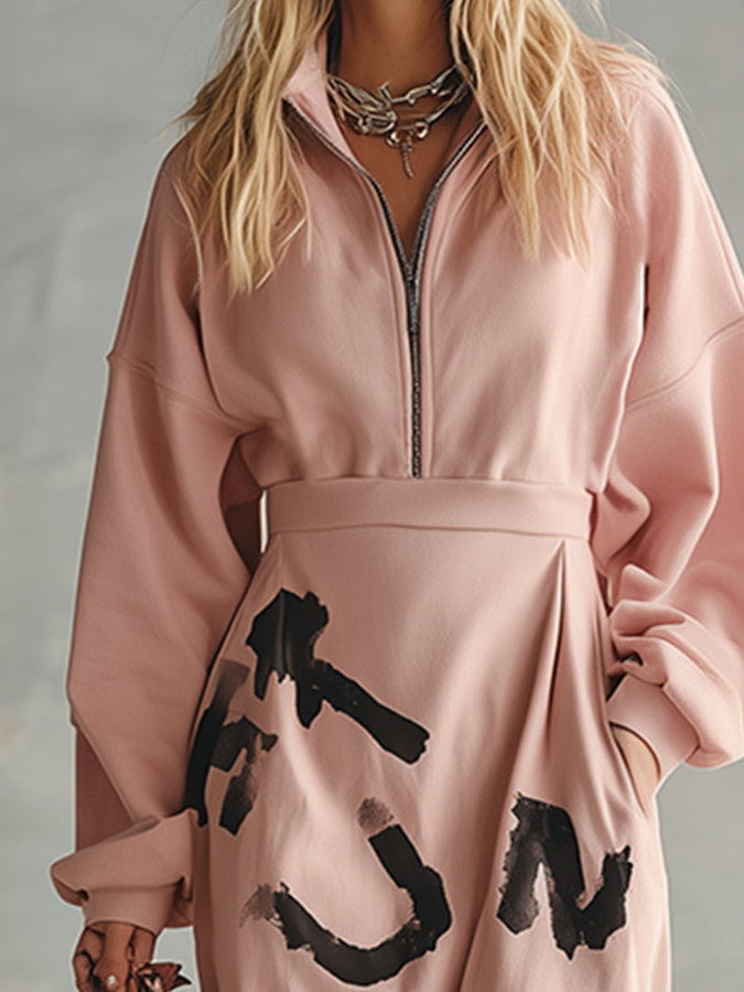 Pull à capuche rose à demi-zip avec imprimé streetwear tendance
