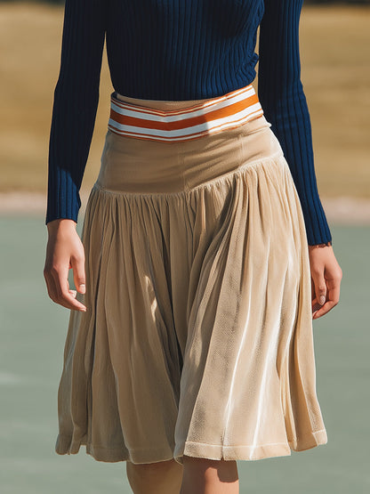 Ensemble Élégant en Tricot Bleu Marine avec Revers et Jupe en Velours Beige