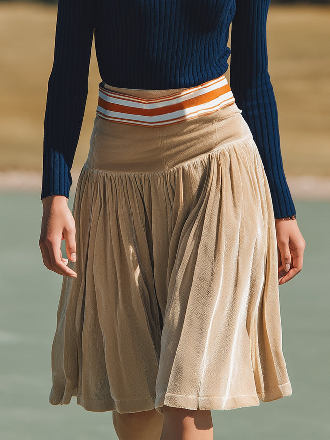 Ensemble Élégant en Tricot Bleu Marine avec Revers et Jupe en Velours Beige