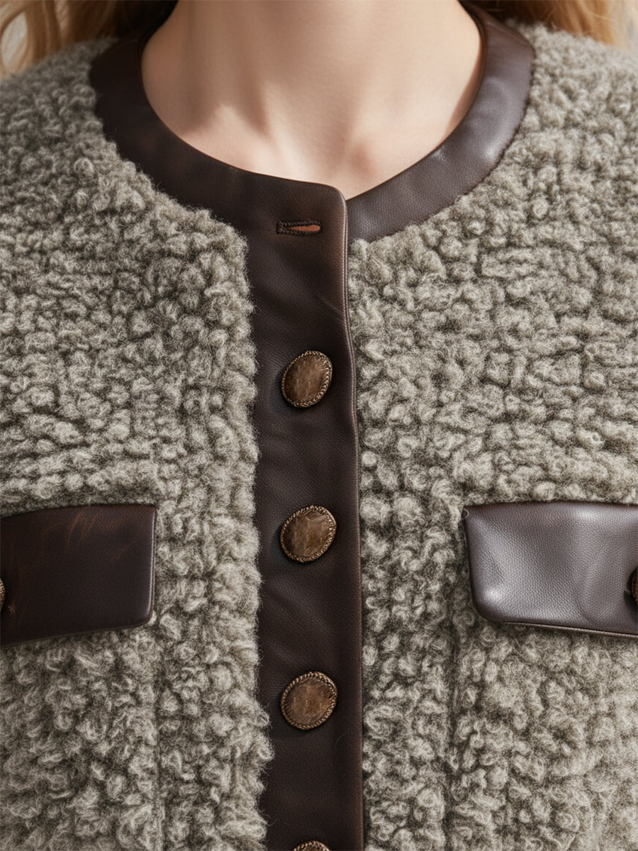 Veste en fausse fourrure à col rond avec élégantes finitions en simili cuir vintage