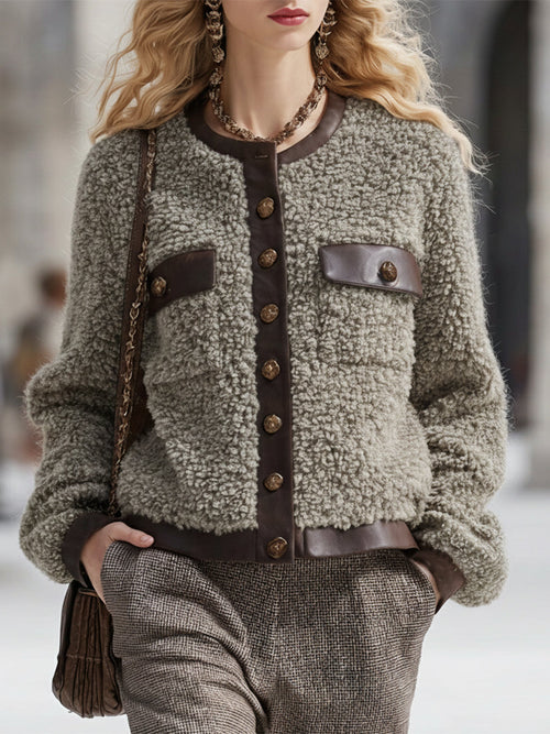 Veste en fausse fourrure à col rond avec élégantes finitions en simili cuir vintage